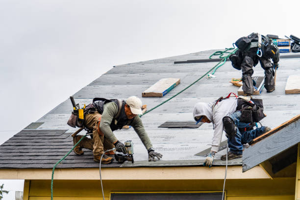 Professional Roofing technician working in Abington, MA